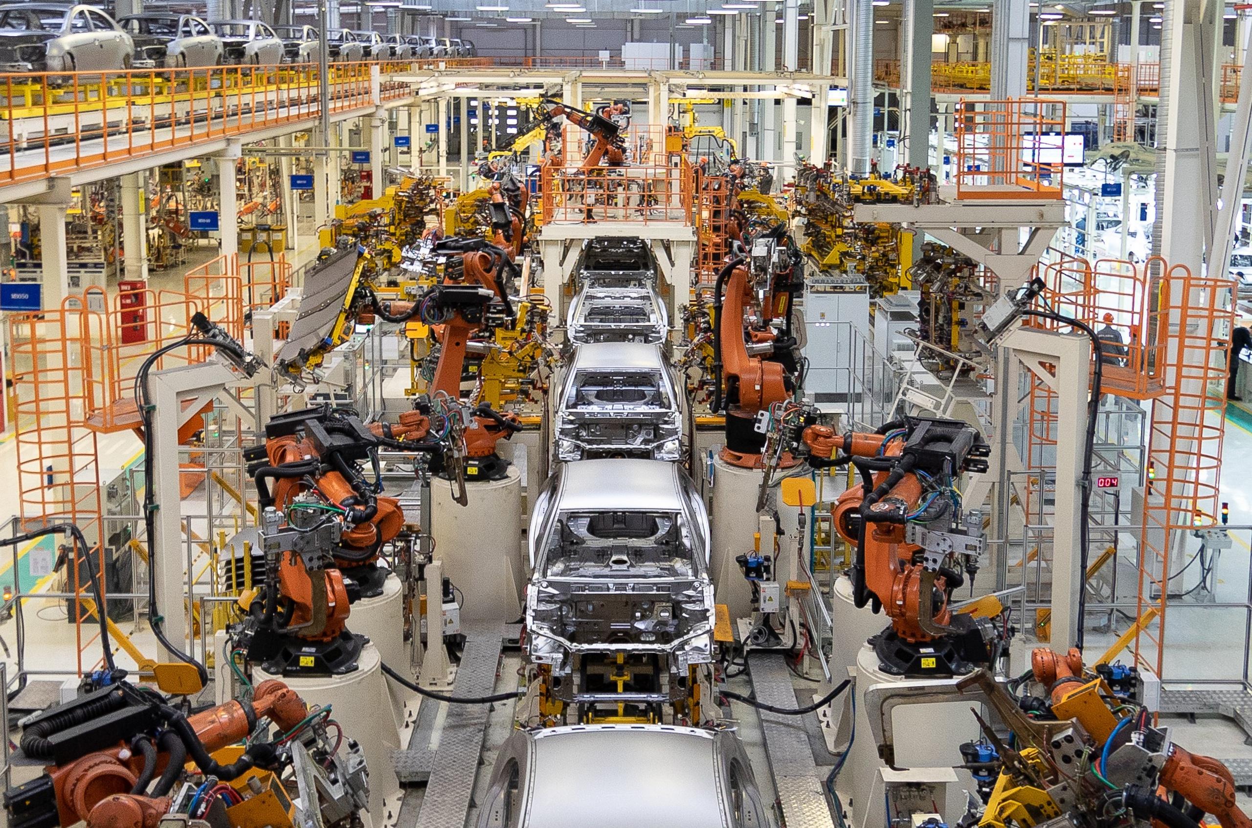 Body of car on conveyor Modern Assembly of cars at plant. automated build process of car body.