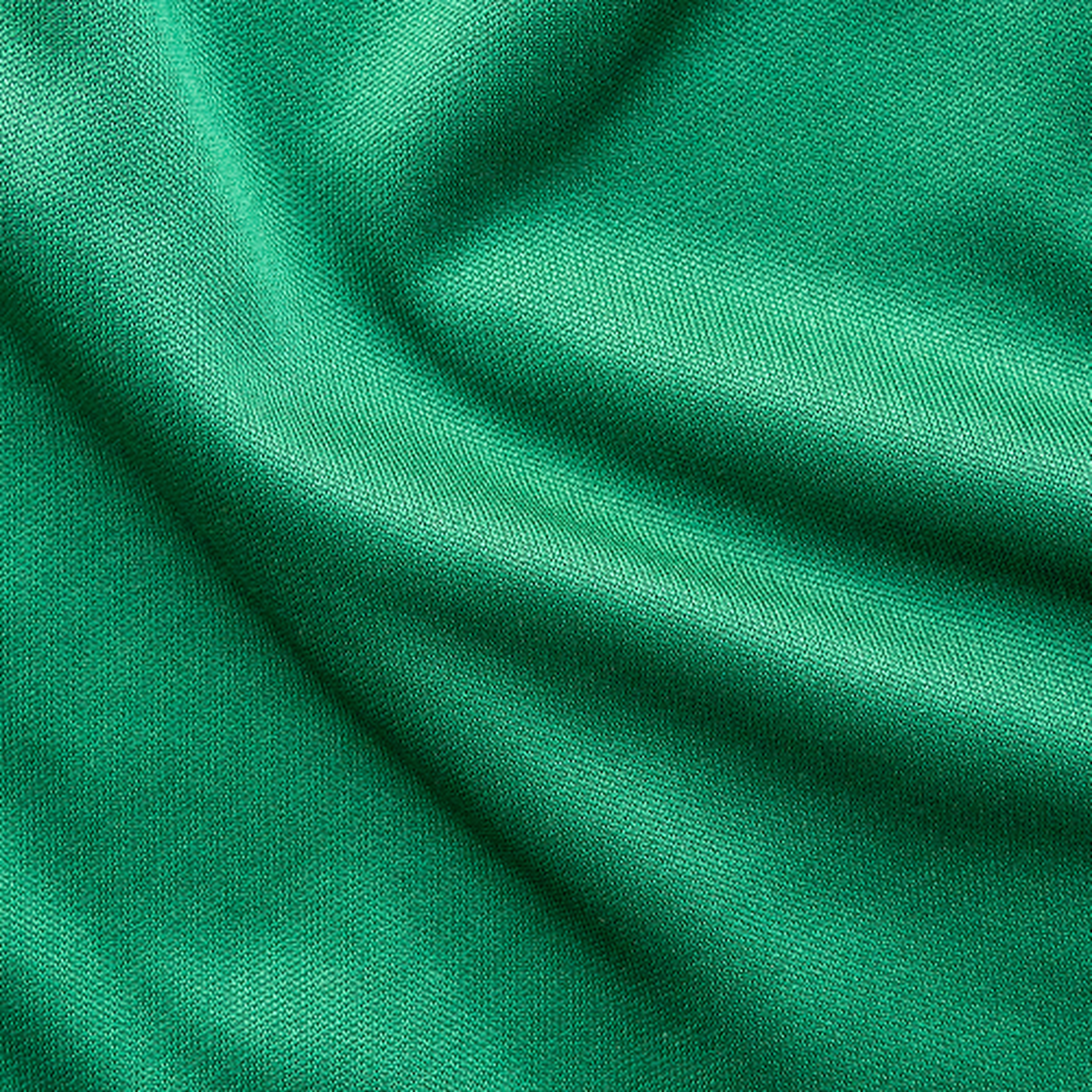 Close up of green textile with creases