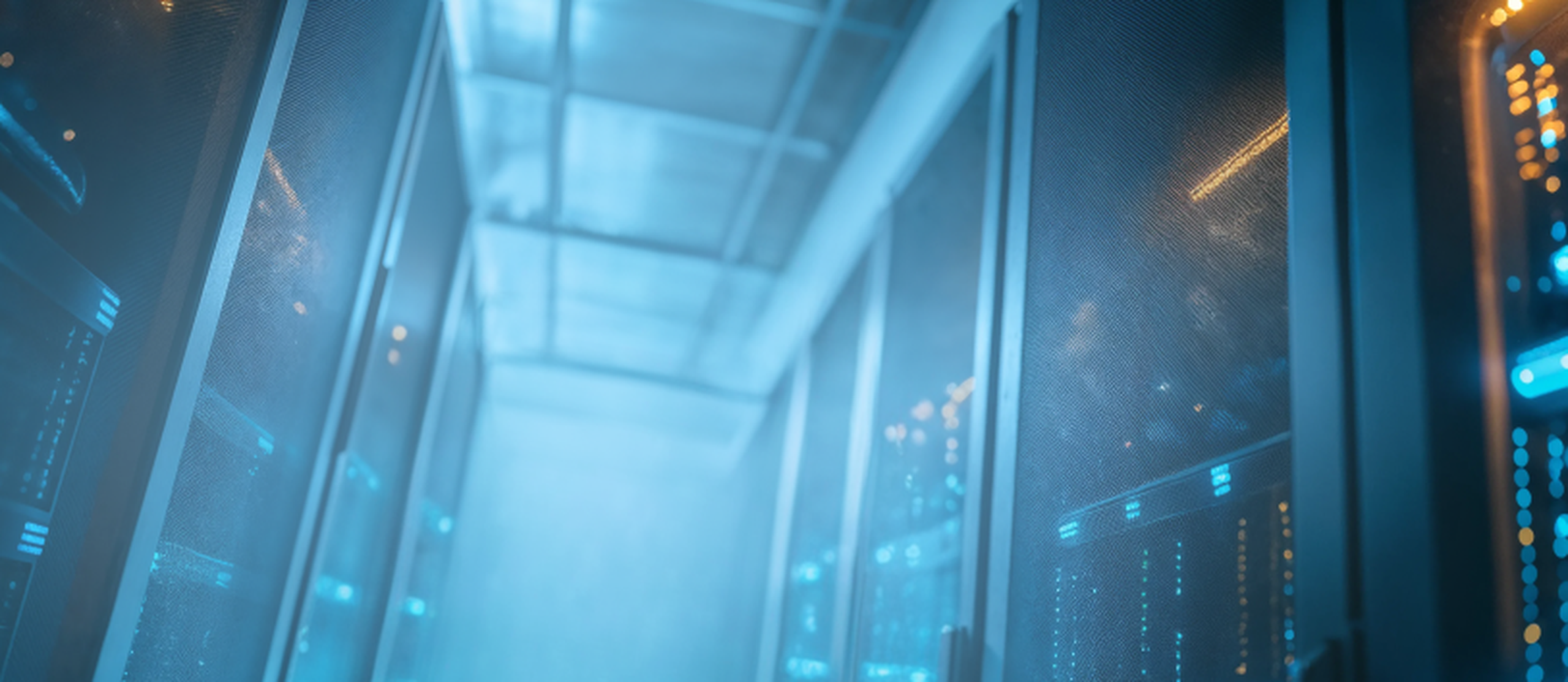 A dimly lit, blue-tinged server room with multiple server racks on either side, featuring blinking lights indicating active equipment.