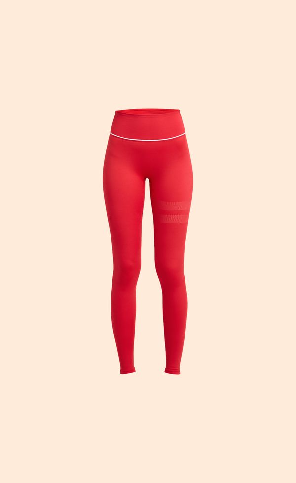 Bright red high-waisted leggings with a thin white band near the top, set against a plain beige background.