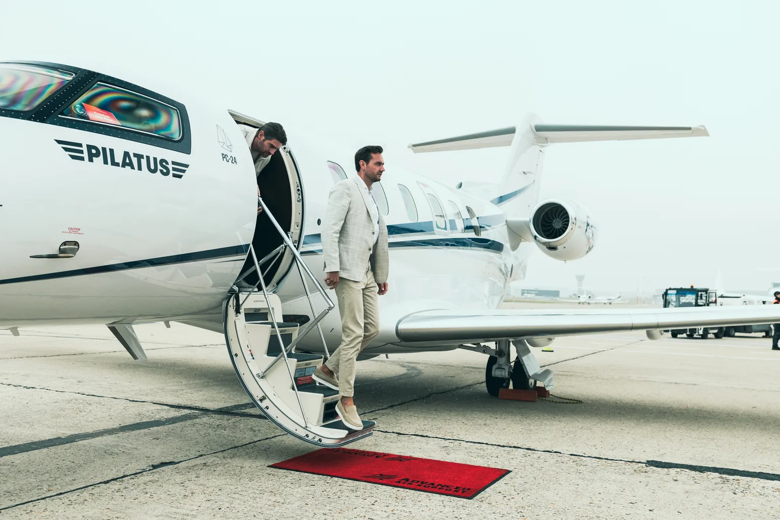 vip-guest-stepping-off-pilatus-private-jet-onto-red-carpet