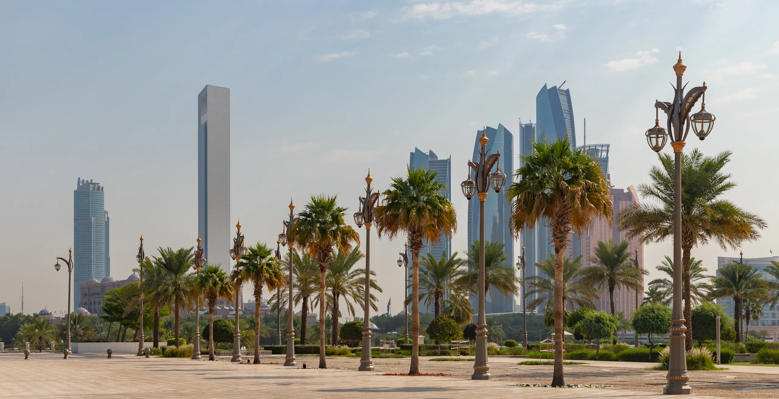 abu-dhabi-city-skyline-with-palm-trees-and-high-rises