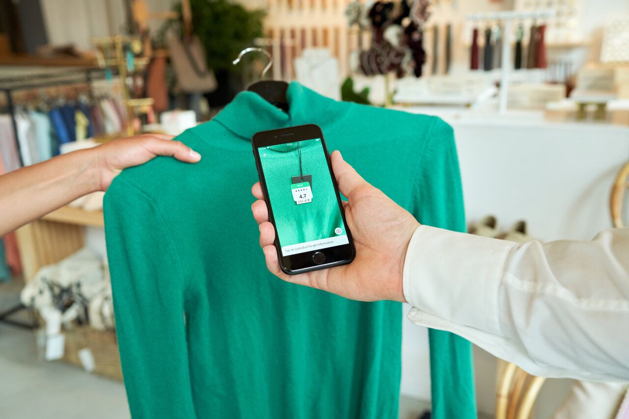 a customer ordering online with a smartphone in store