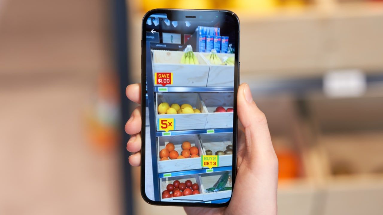 Retail customers checking personalized offers using smart data capture. 