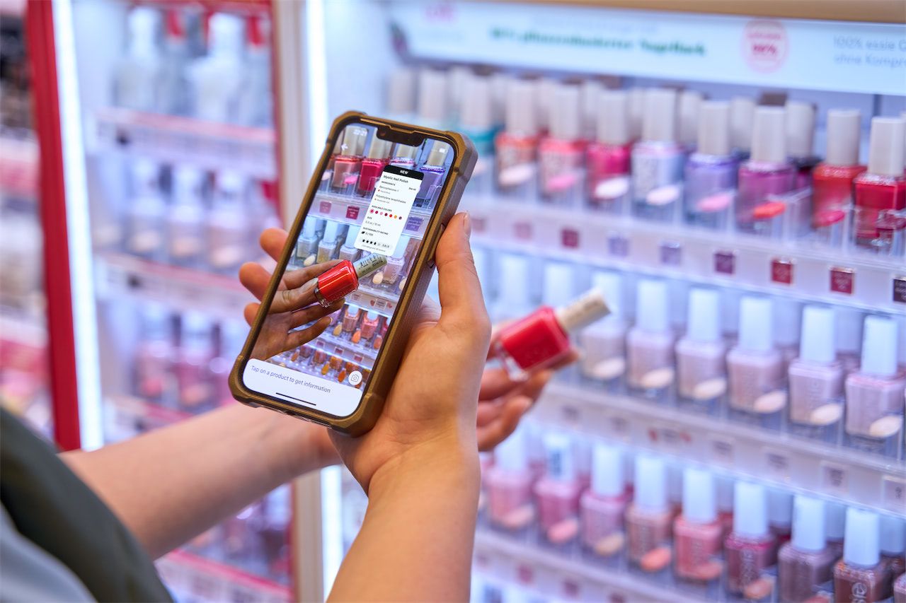 Smart data capture being used on a smartphone to provide product information to a consumer browsing nail polishes in-store.