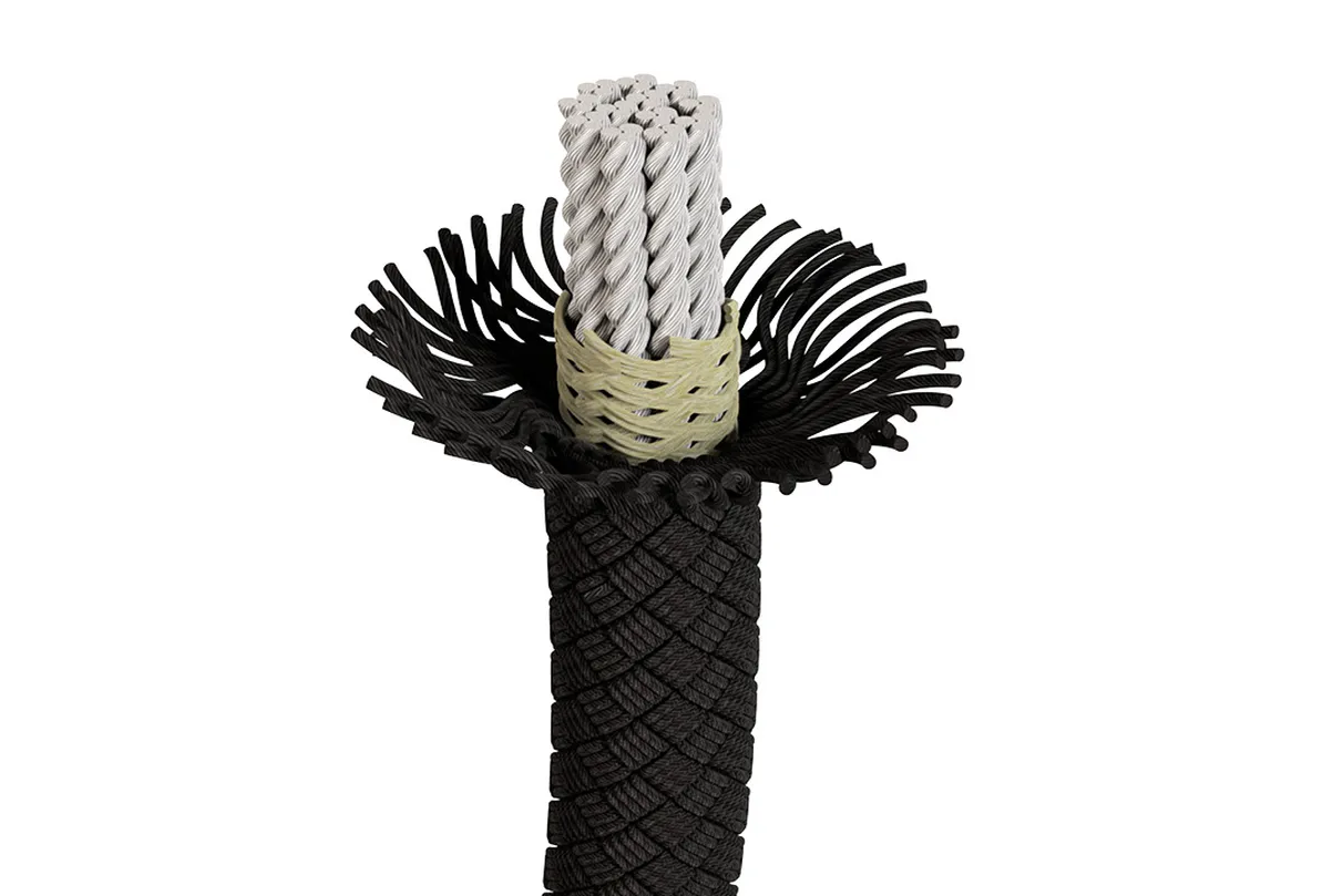 Cross-section of a black braided rope with exposed internal fibers, showcasing its durable and intricate construction.