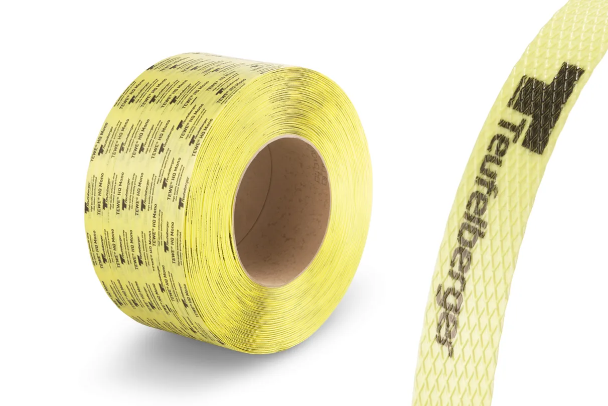A coil of yellow printed strapping with the brand name "Teufelberger" visible on the strap. The strapping features a textured surface and black printed text.