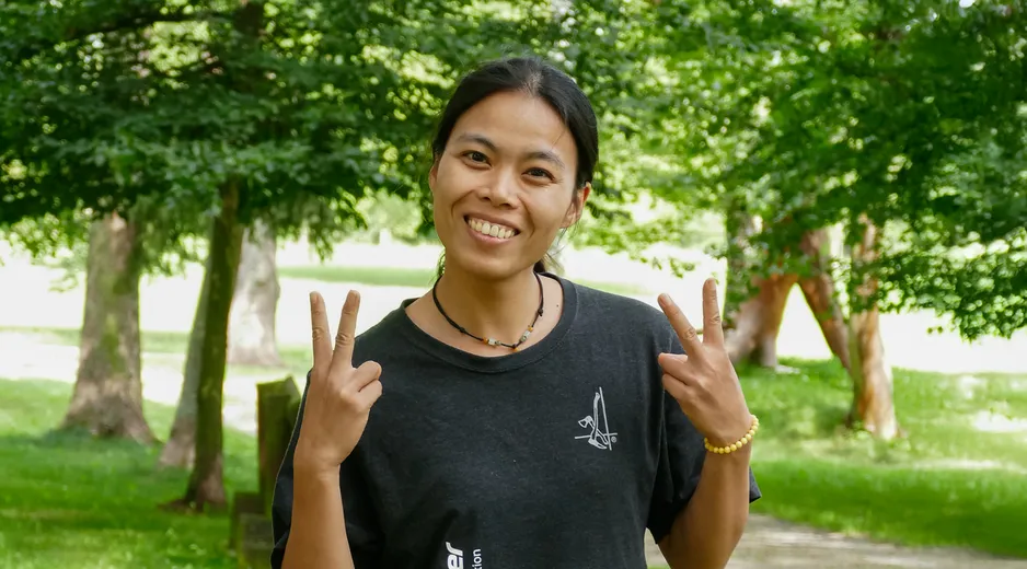 Portrait of our Ambandssador Yanling with a forest in the background