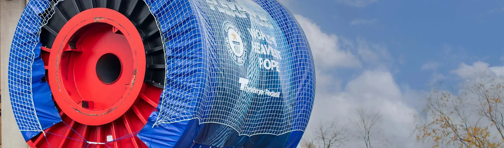 Large offshore cable reel being transported on a heavy-duty trailer from Redaelli manufacturing facility