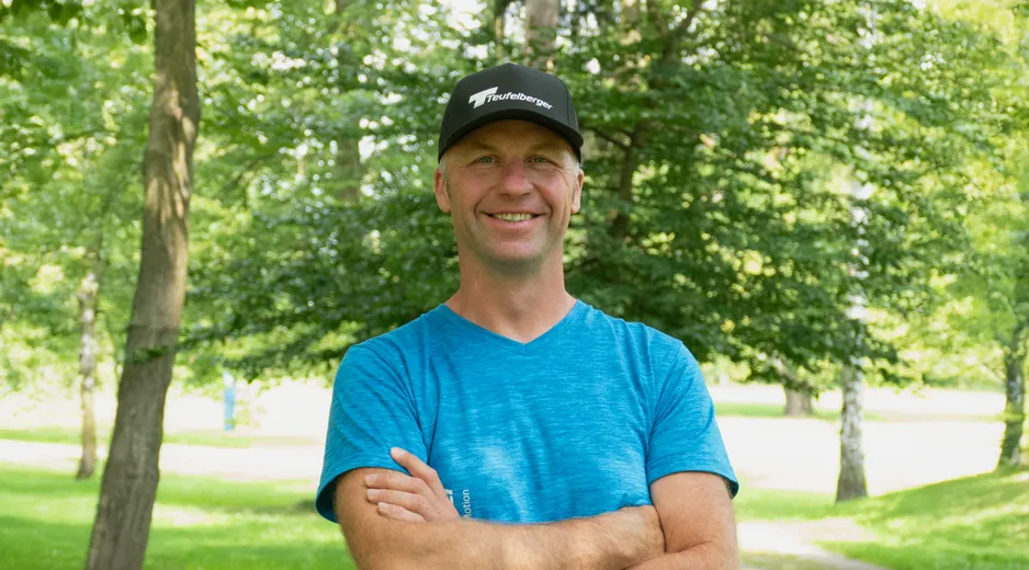 Portrait of our Ambassador Marcin Anczakowski with a forest in the background