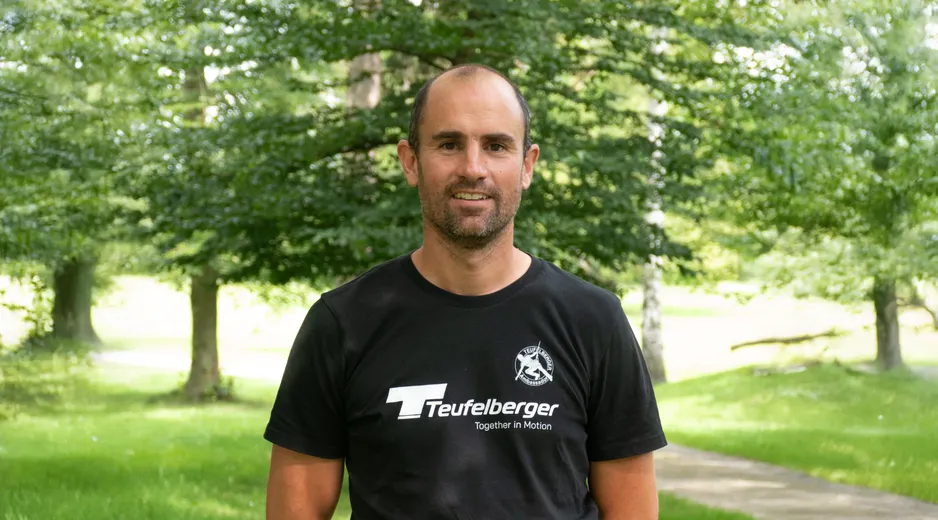 Portrait of our Ambassador Marcin Anczakowski with a forest in the background