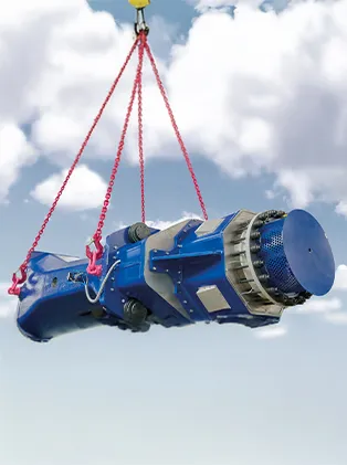 Large blue industrial component being lifted by red chains attached to a crane – precise heavy-lifting technology for industrial applications.