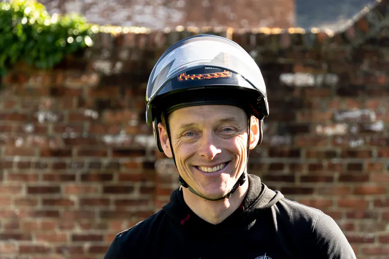 Portrait of our Ambassador Beau with a brick wall in the background