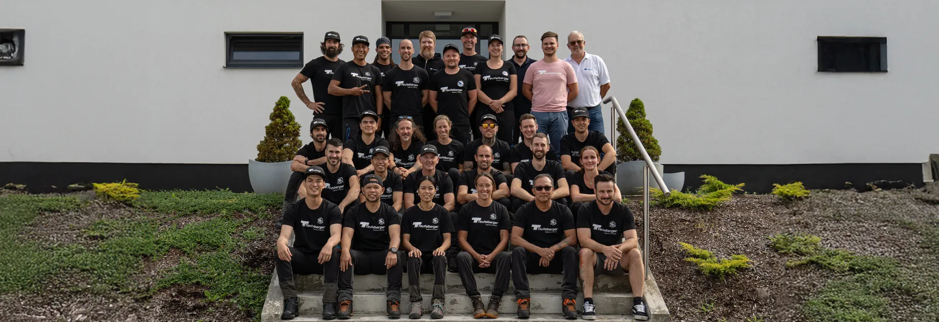 group picture of our Teufelberger Treecare Ambassadors on the staircase of the production facility in Czech Republic