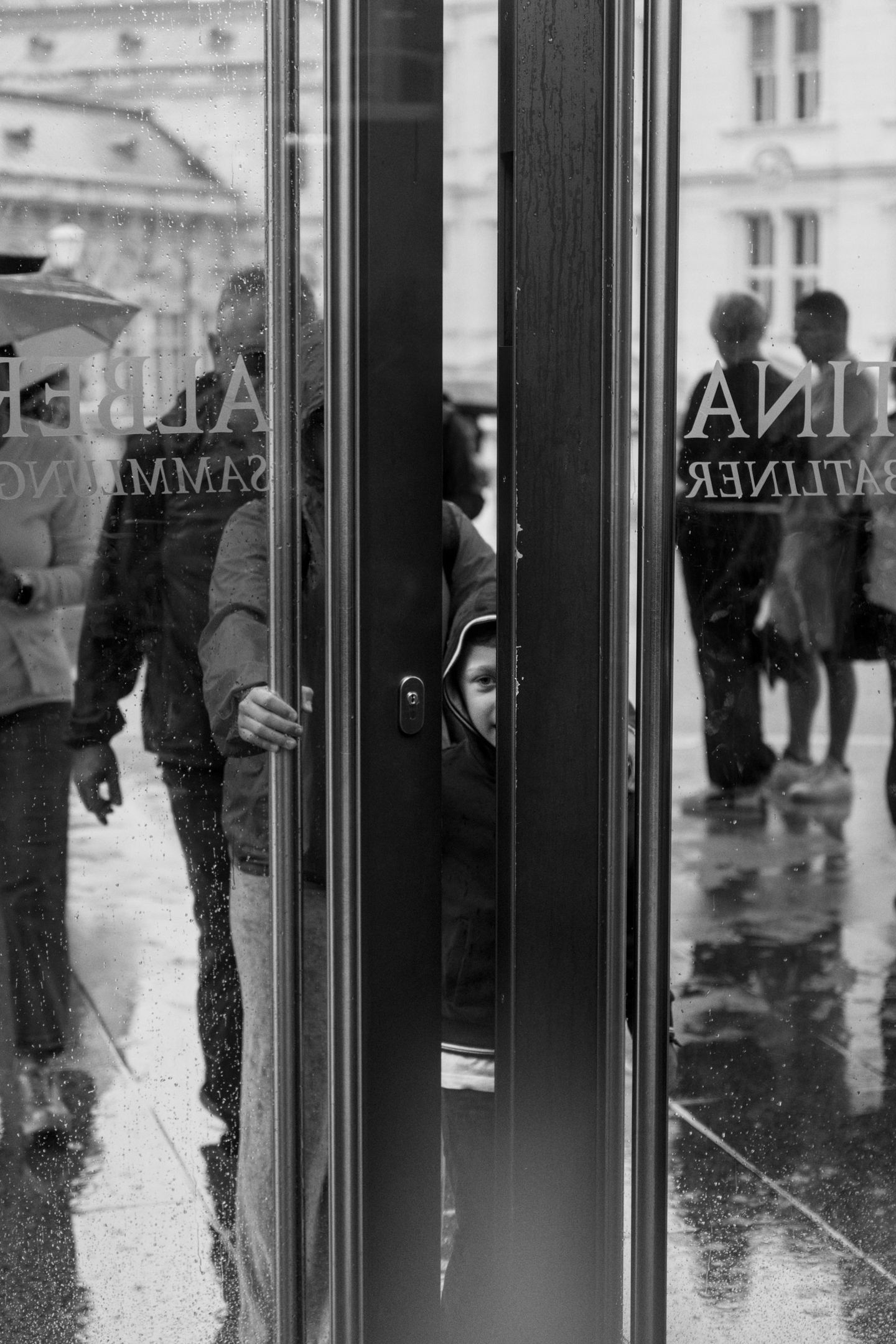 A boy and his family walk through a museum door