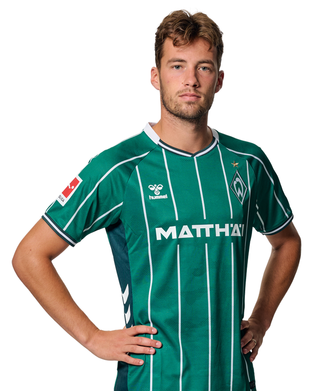 Olivier Deman im grün-weiß gestreiften Trikot mit Logos, der mit den Händen in den Hüften steht und in die Kamera blickt.