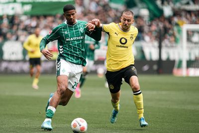 Salim Musah battling for the ball with BVB's Waldemar Anton.