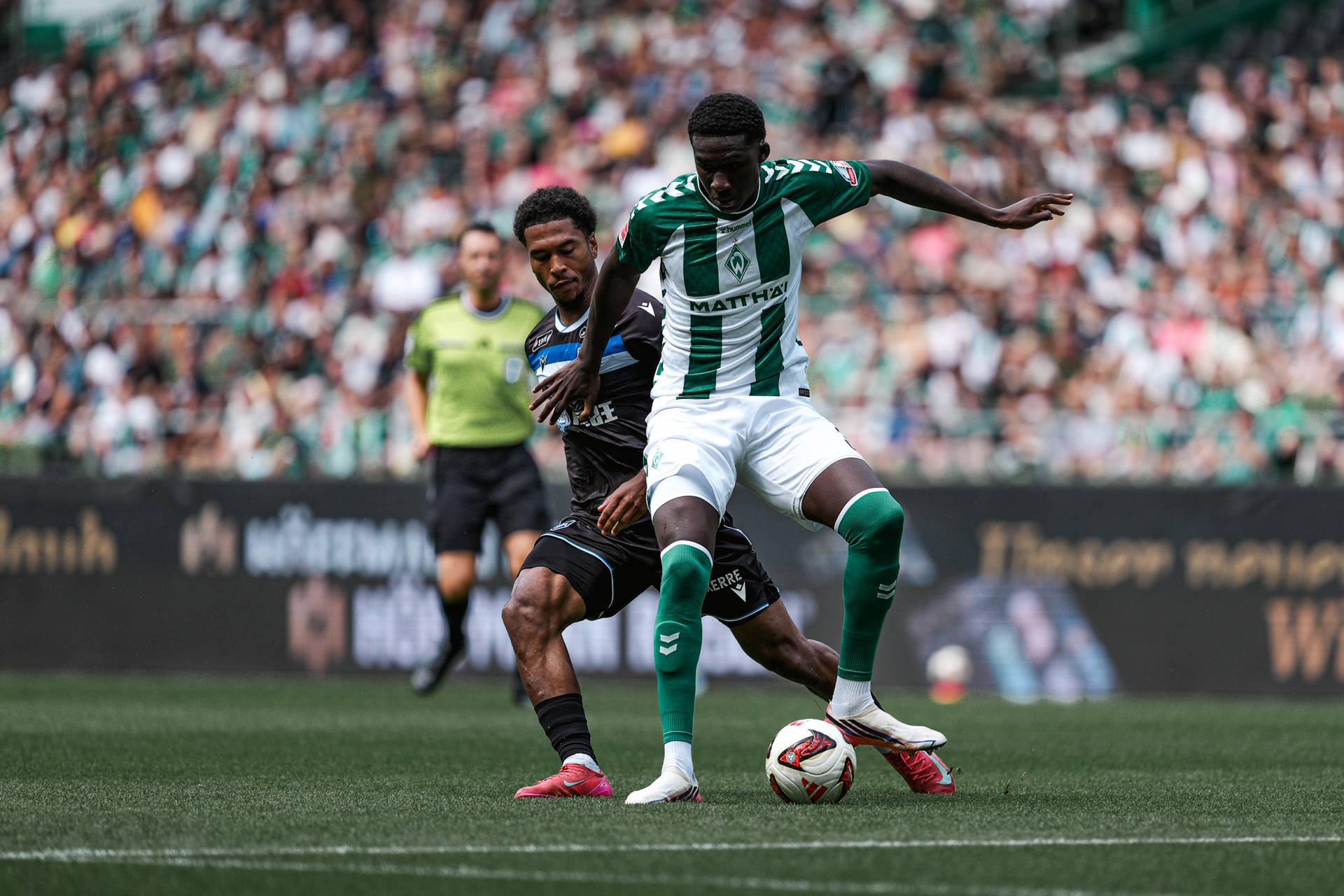 Karim Coulibaly protects the ball against Auxerre.
