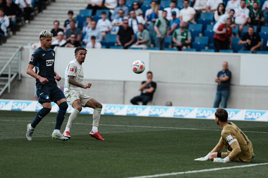 Njinmah looks at the ball after Oliver Bauman has just saved his shot.