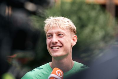 Oskar Wójcik speaks to the media.