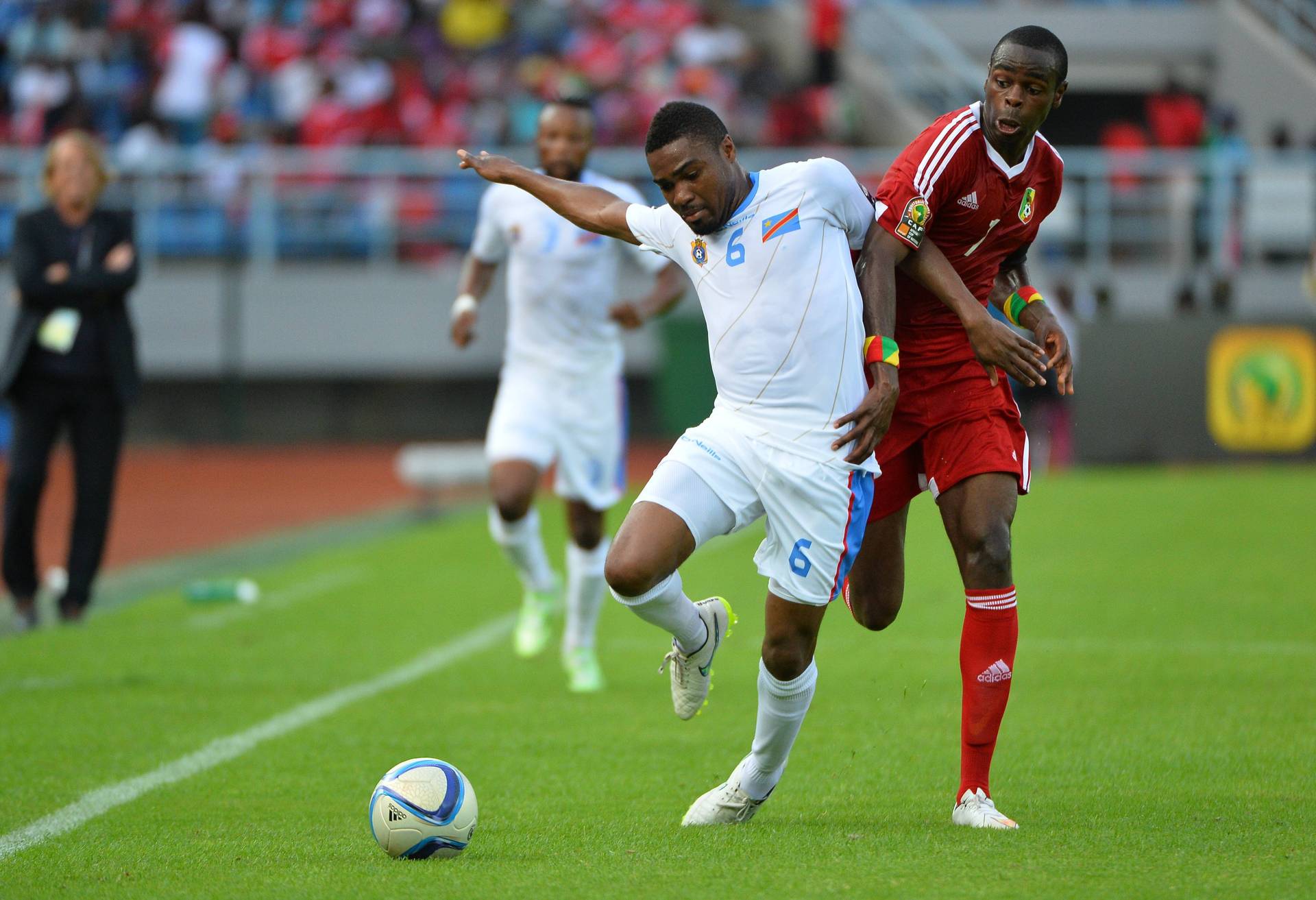 Cedric Makiadi challenging for the ball with DR Congo at the Africa Cup of Nations.