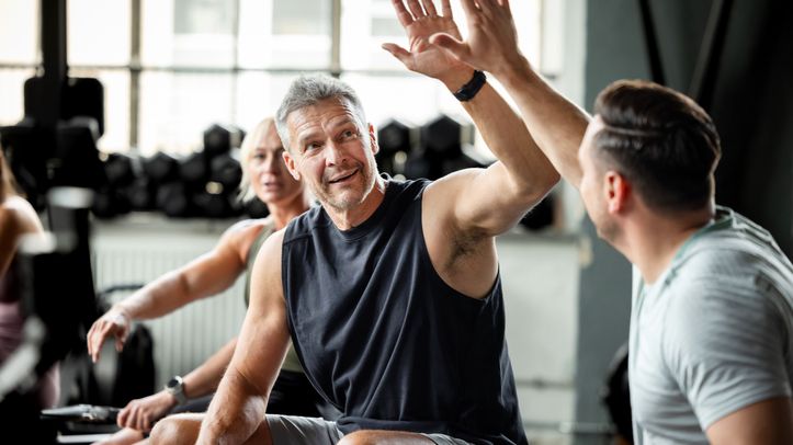 fitness training Investing in health with stocks: Man working out with another buddy