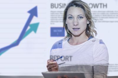 woman presents investment trends 2026