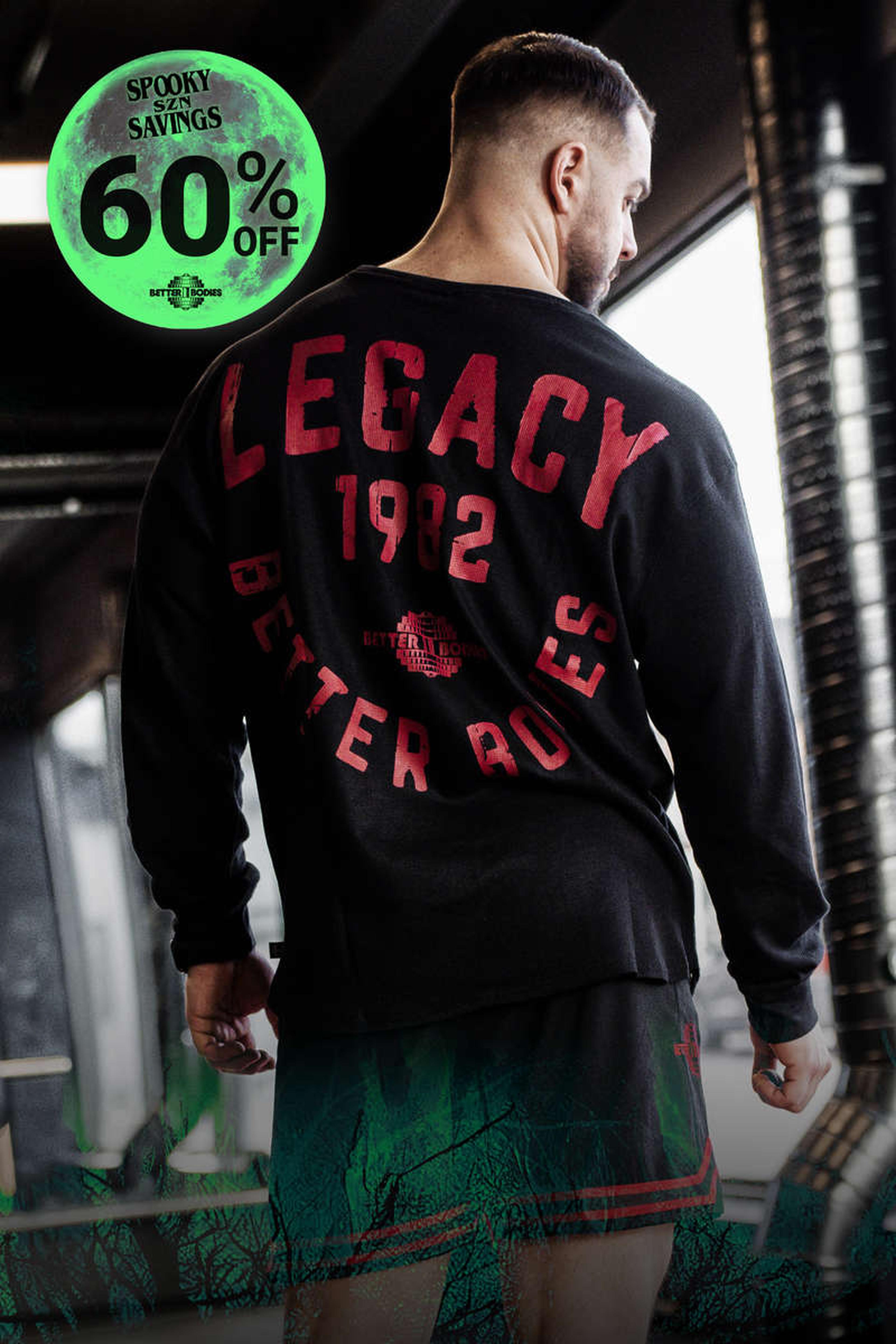 Man in gym wearing a "Legacy 1982 Better Bodies" shirt, with a "Spooky Savings 60% Off" graphic in the corner.