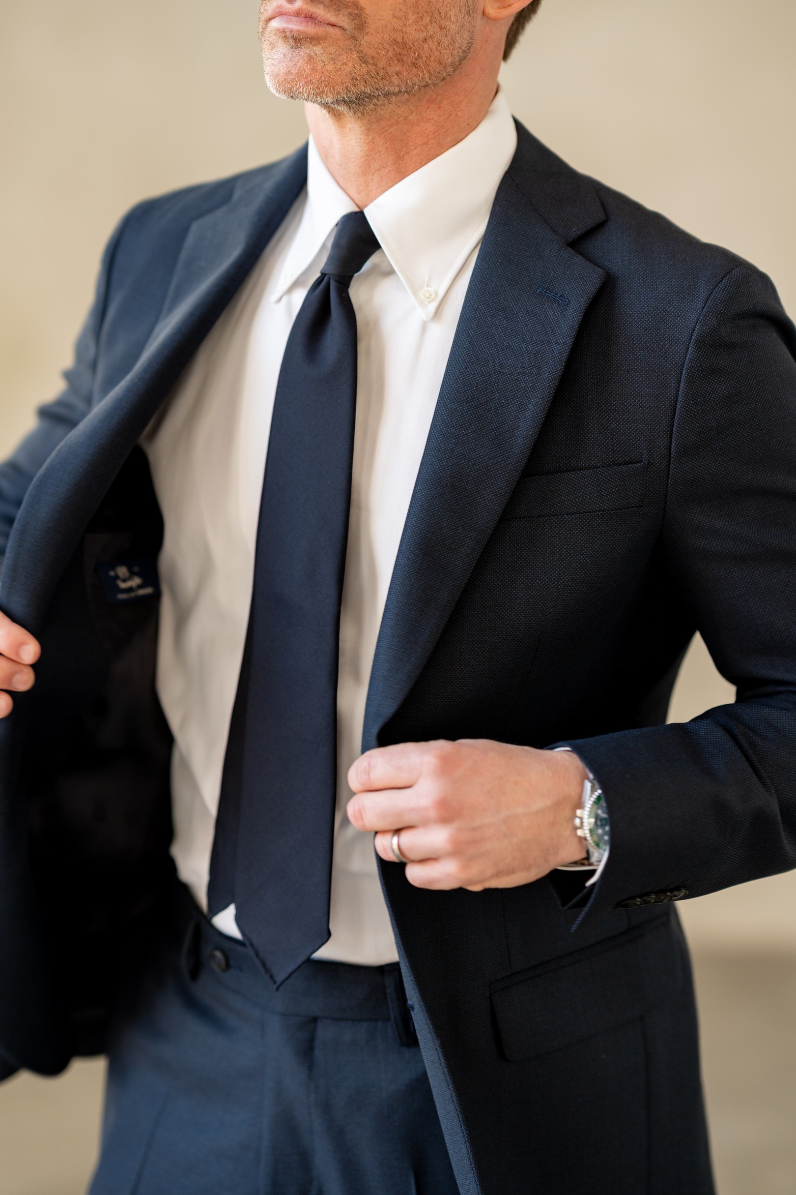 Man wearing navy suit