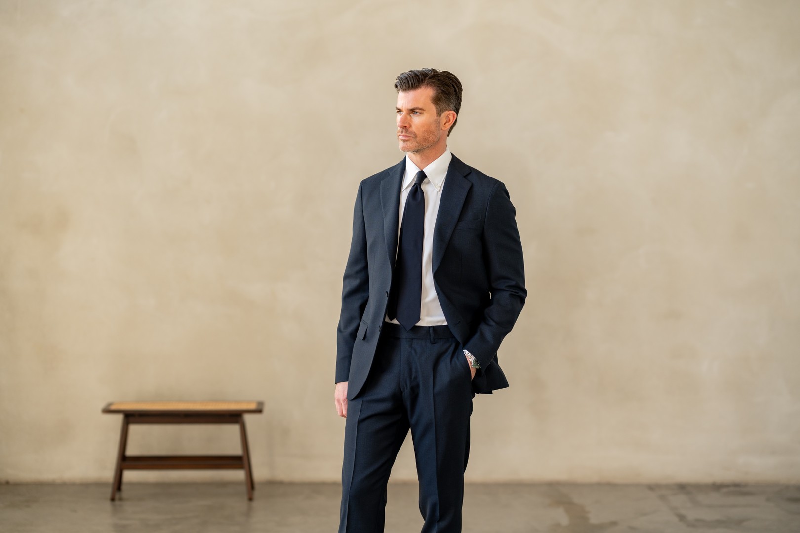 Man wearing navy suit