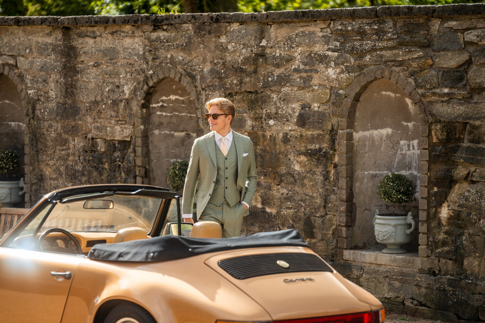 Man wearing green suit