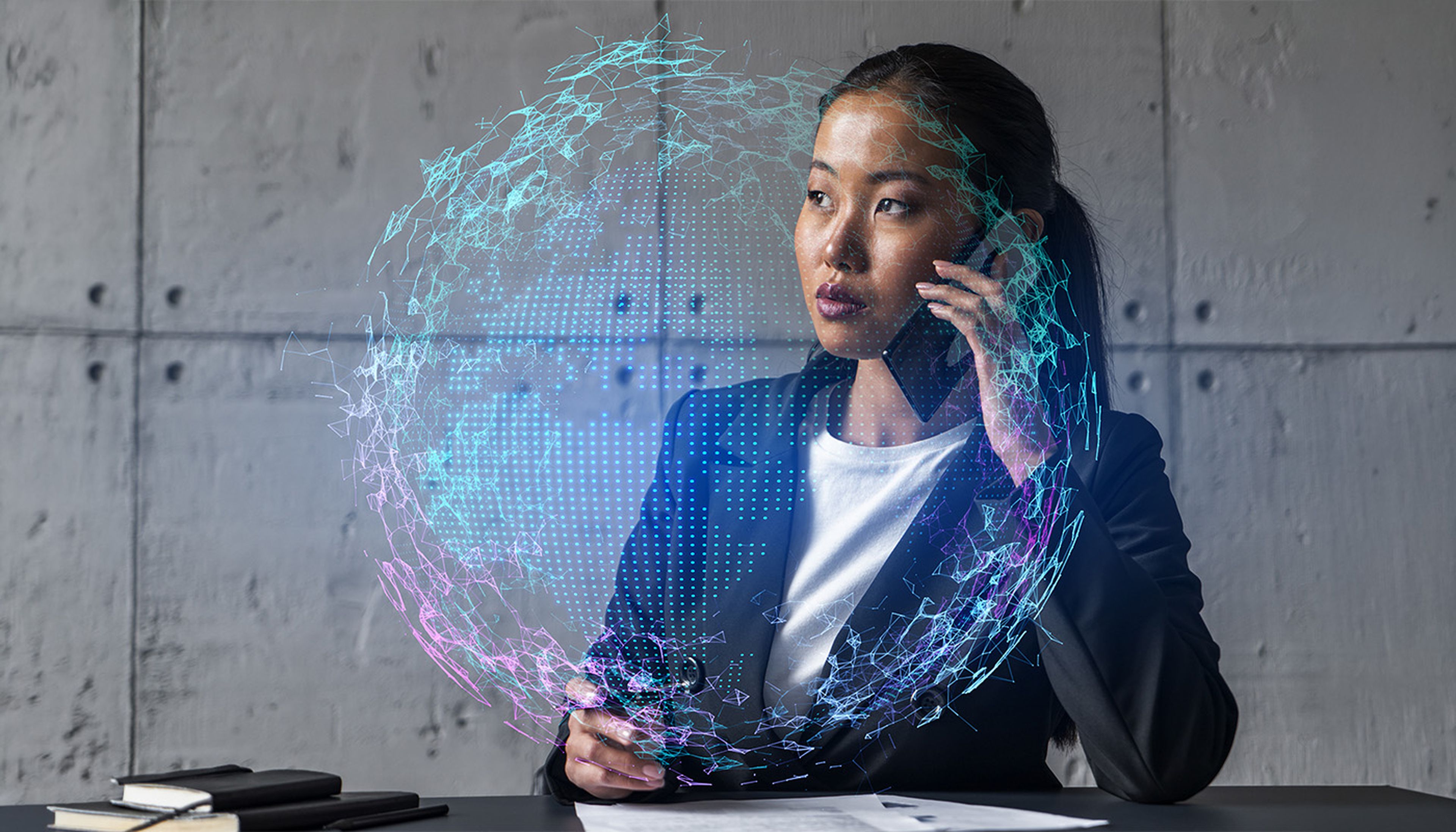 Businesswoman speaking on the phone with a digital world map hologram overlay.