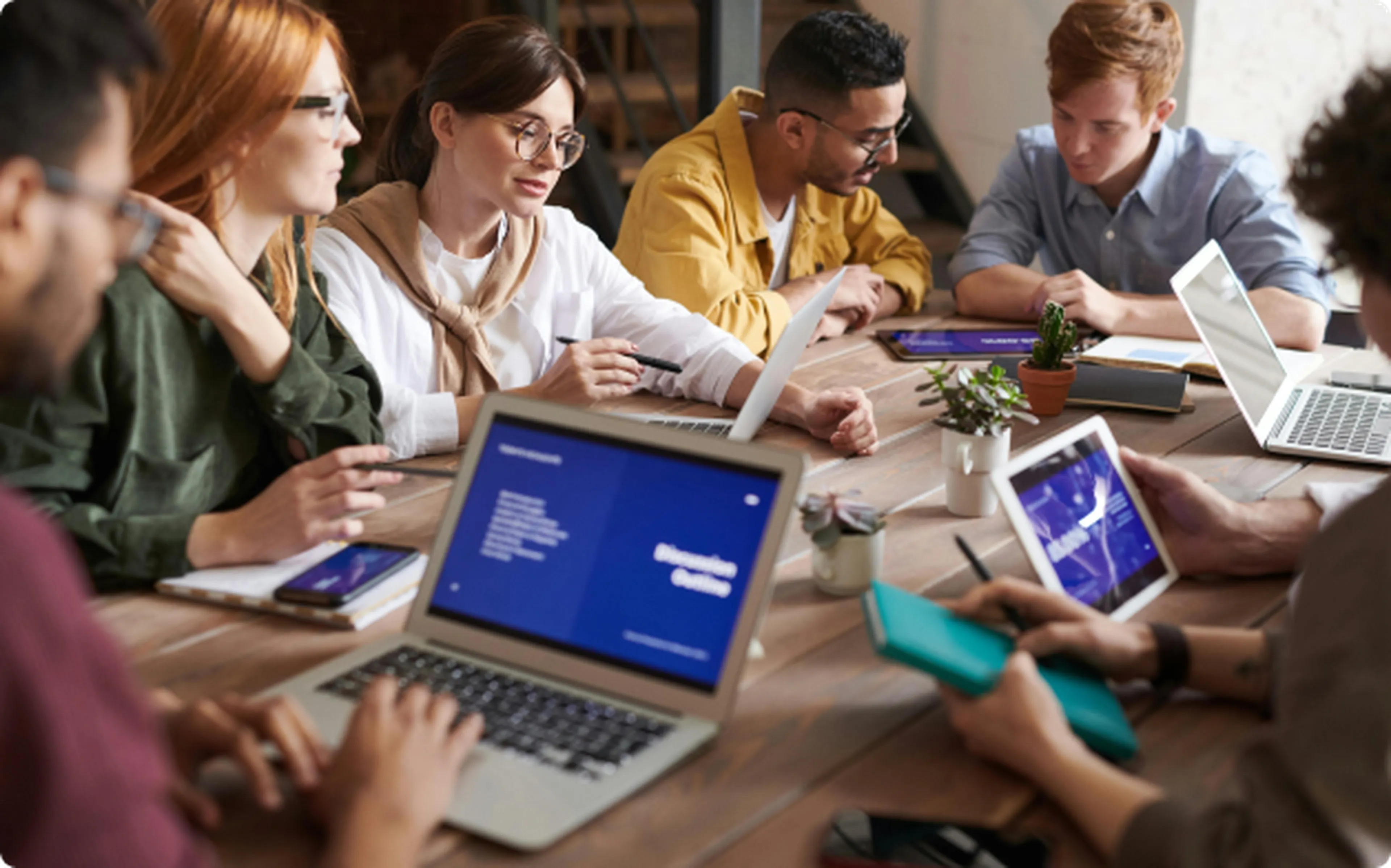 team working in a table with laptops