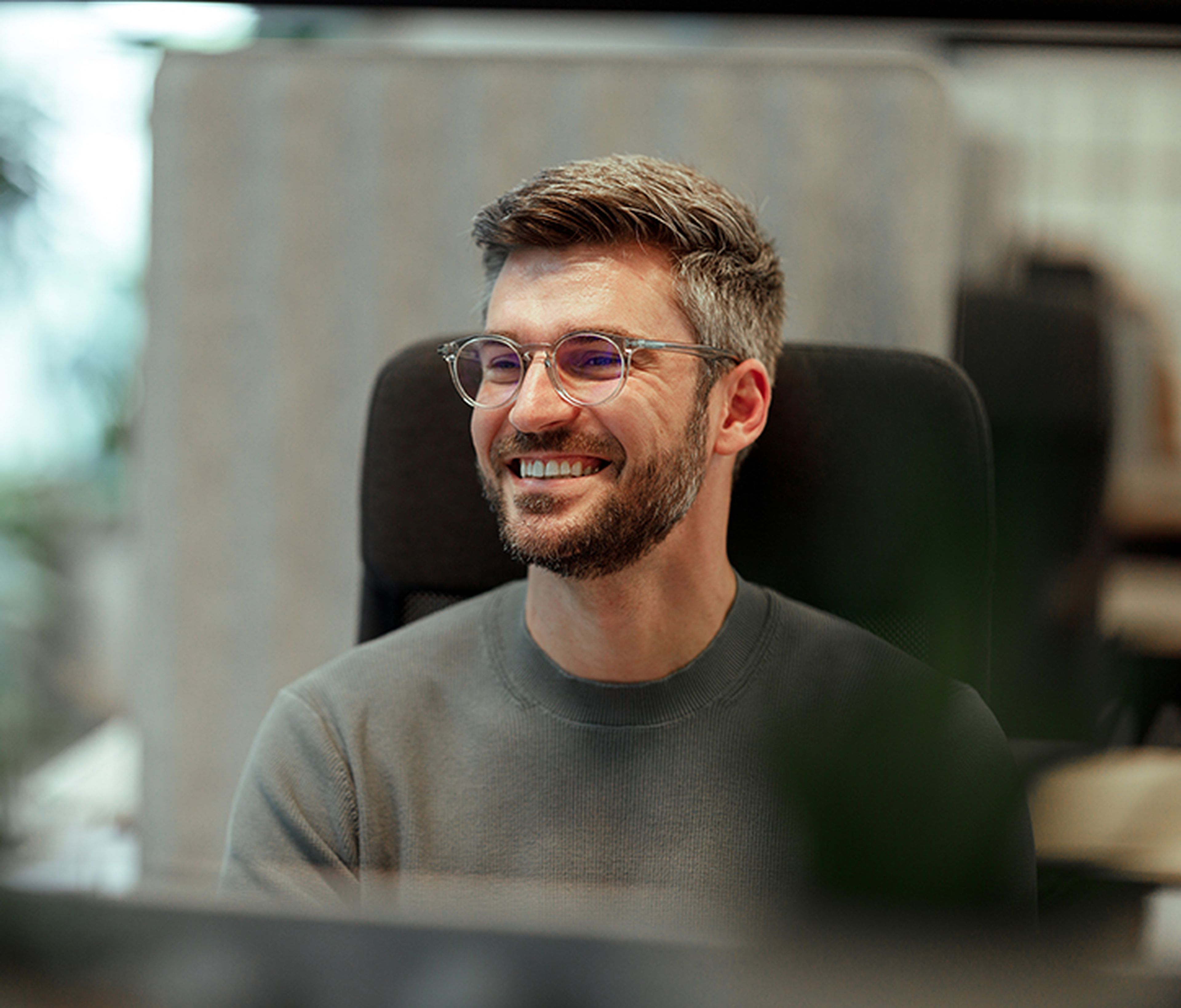 Two people in a business meeting having a joyful discussion