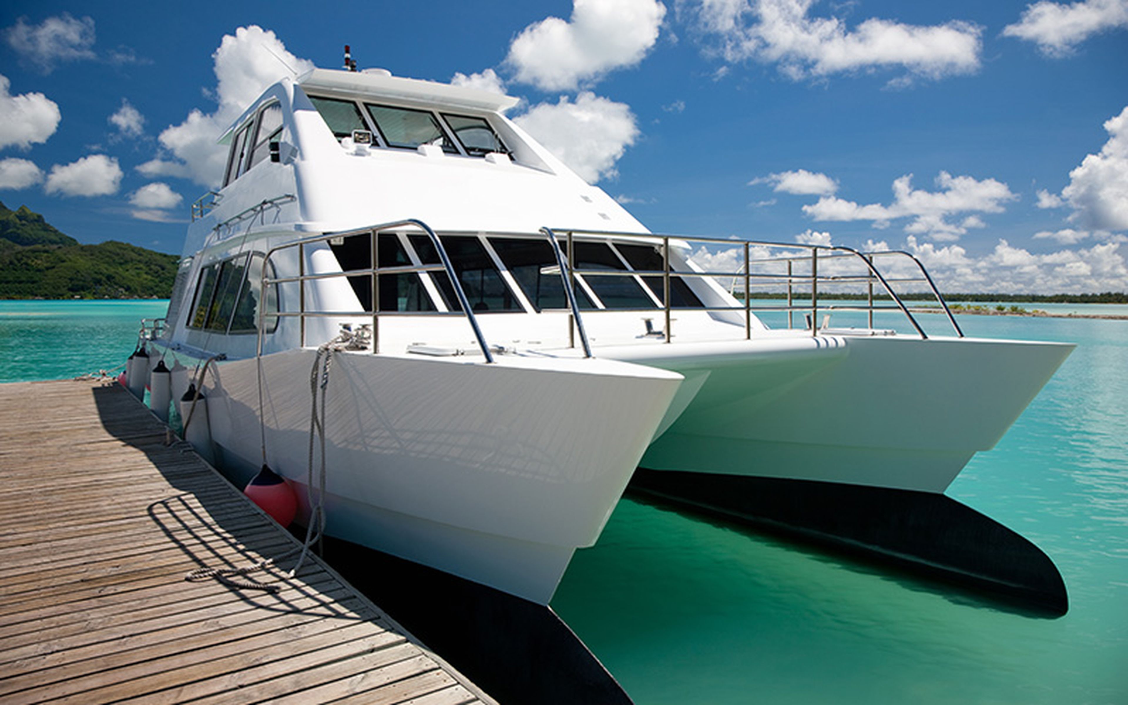 A catamaran's twin-hull design grants it improved speed and fuel efficiency without sacrificing stability, making it ideal for short-haul passenger trips. However, it is less suited for heavy freight due to its reduced internal carrying capacity and greater susceptibility to bad weather.