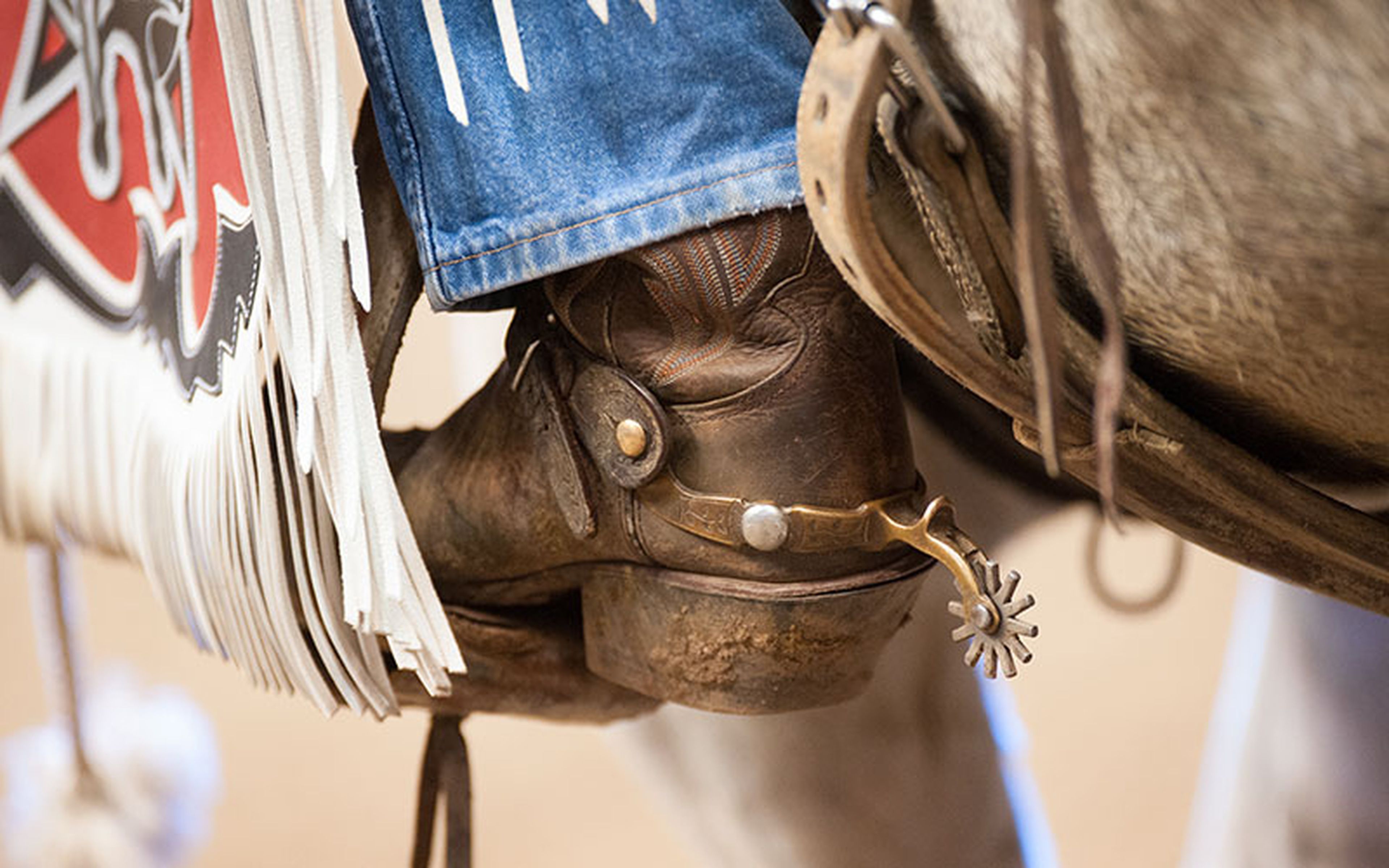 Durable fabric and a comfortable fit make jeans an easy choice for modern cowboys, who continue to spend long hours on horseback, tending cattle in the rugged American West. Thanks to their practicality, jeans have become an icon of the cowboy lifestyle.