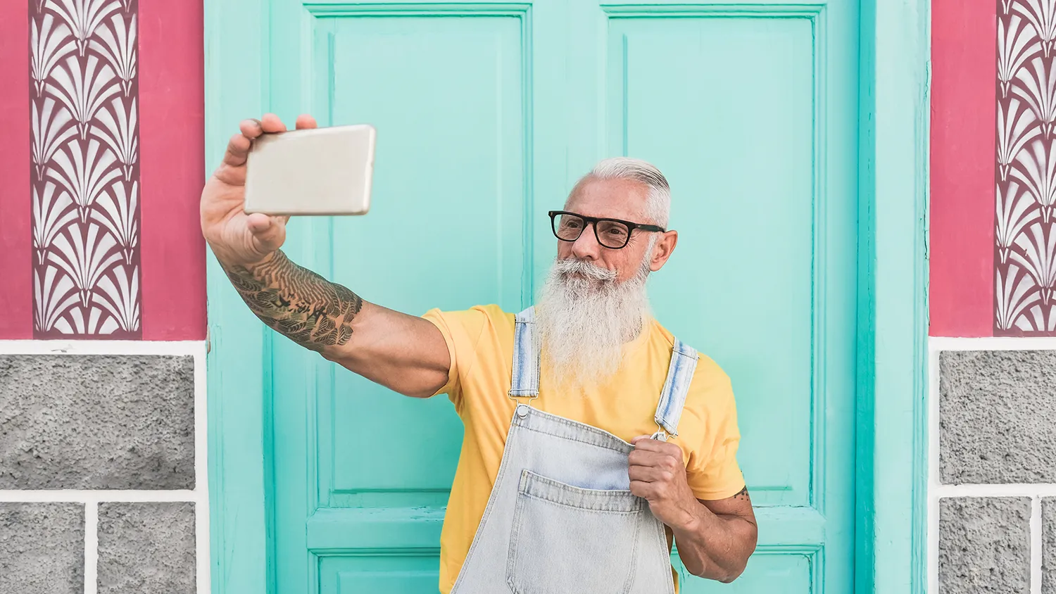 Trendy Senior Man Taking a Selfie Using a Mobile Phone
