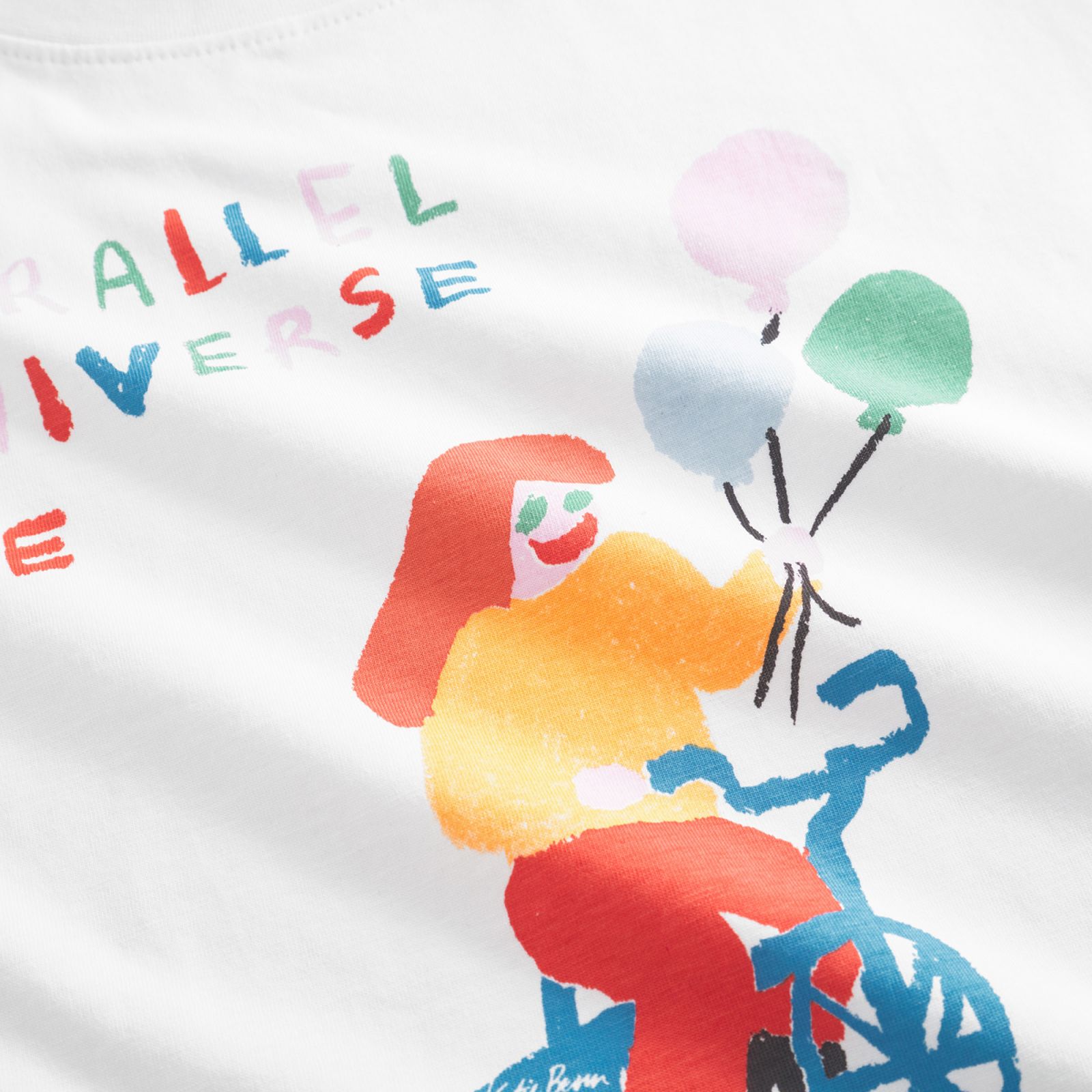 Illustration of a person on a bike holding balloons, with colorful text "PARALLEL UNIVERSE" on a white background.