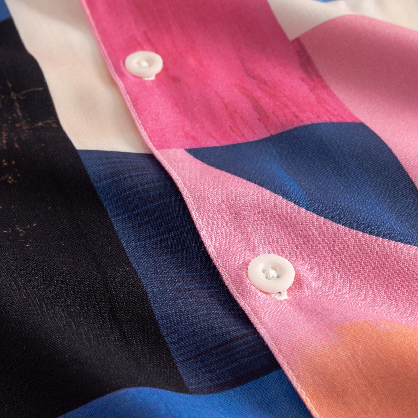 close-up of ecovero shirt in multi colors