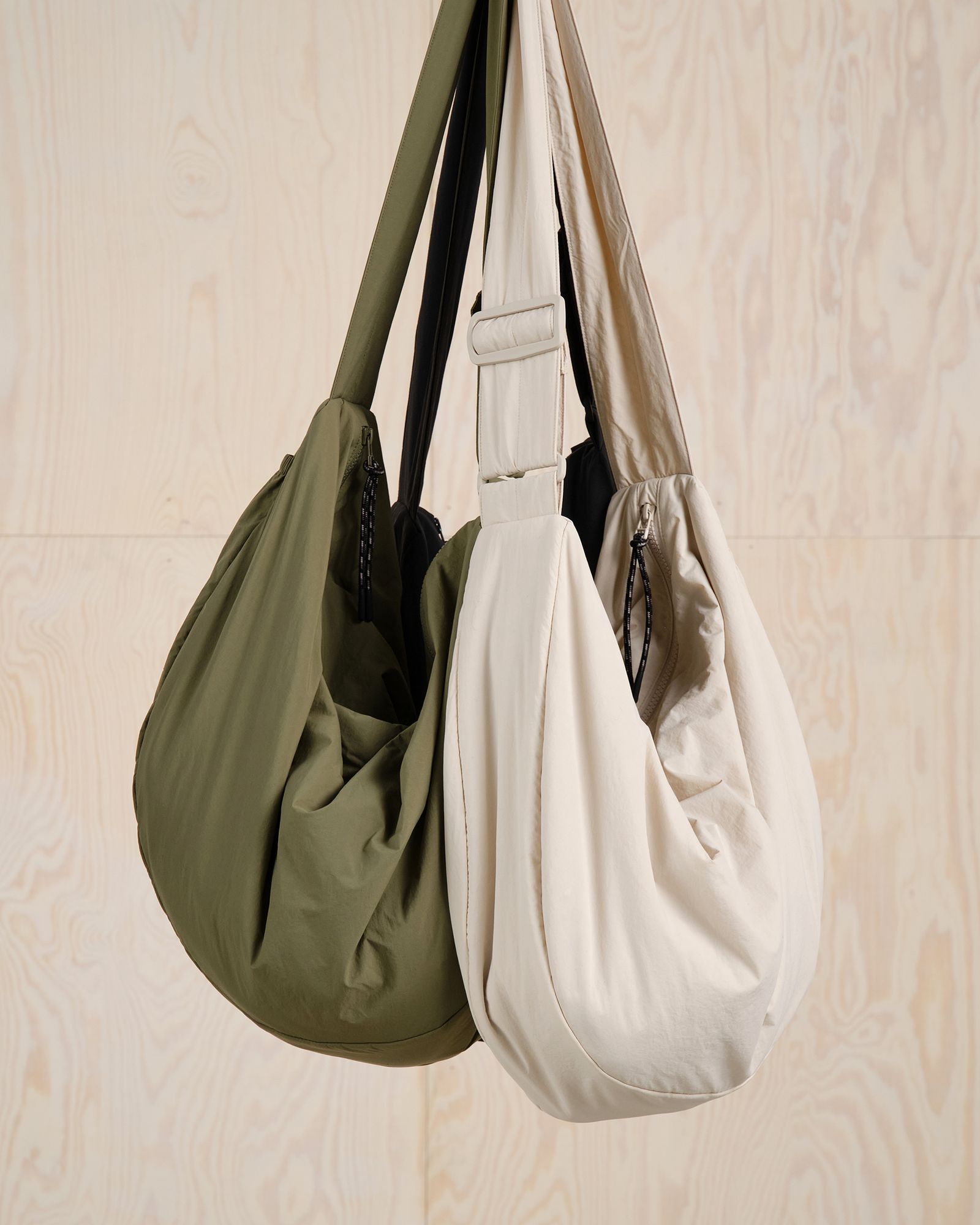 bags hanging together in front of a wall