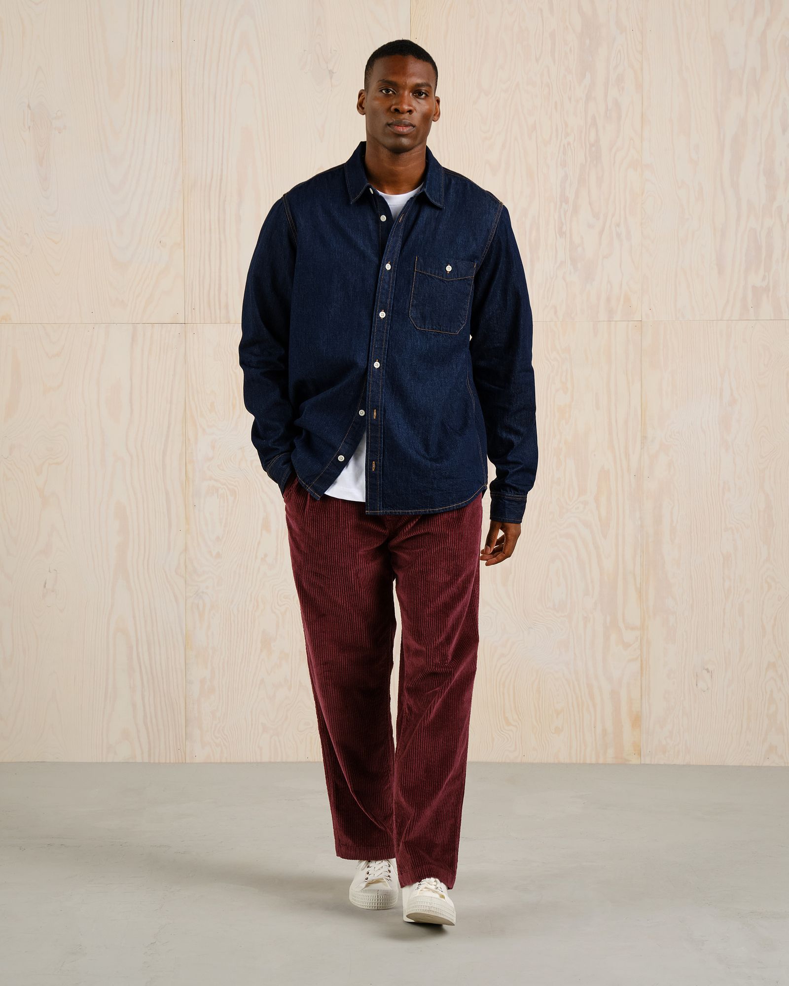 man posing in denim shirt and pants