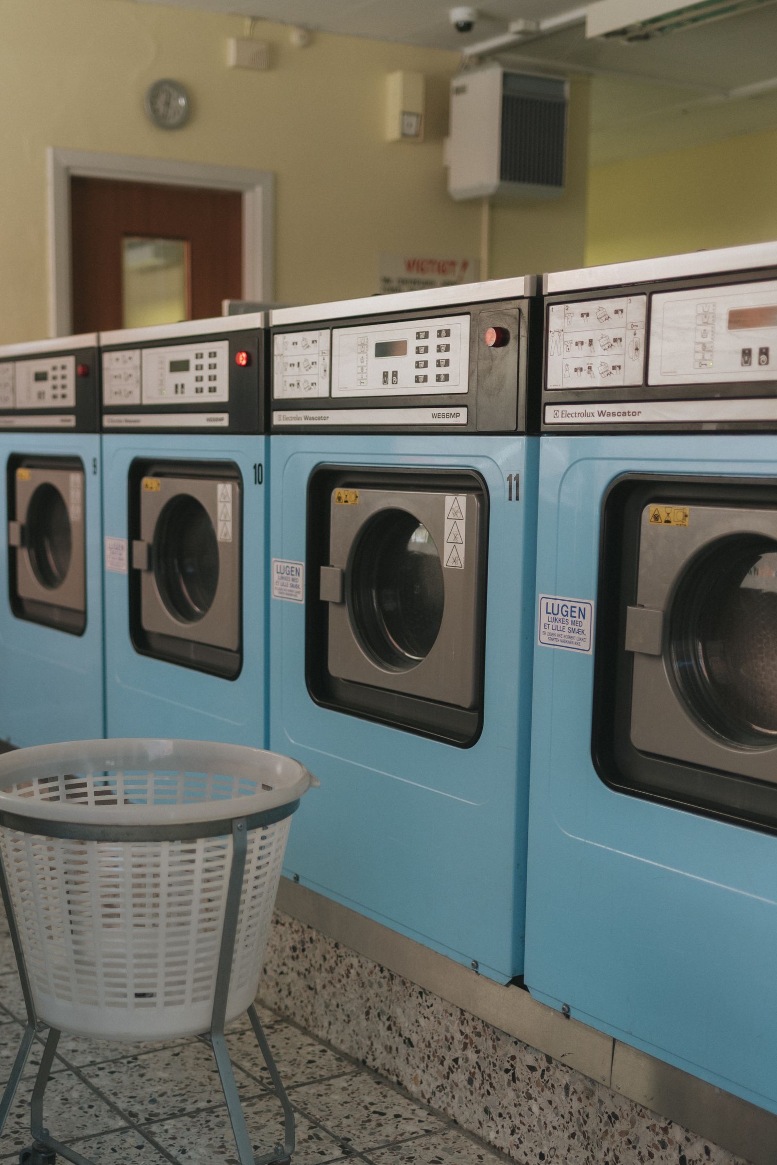 blue laundry shop with laundry basket