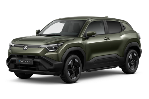 Green Suzuki SUV with a sleek design, featuring dark tinted windows and stylish black alloy wheels, angled front-left view.