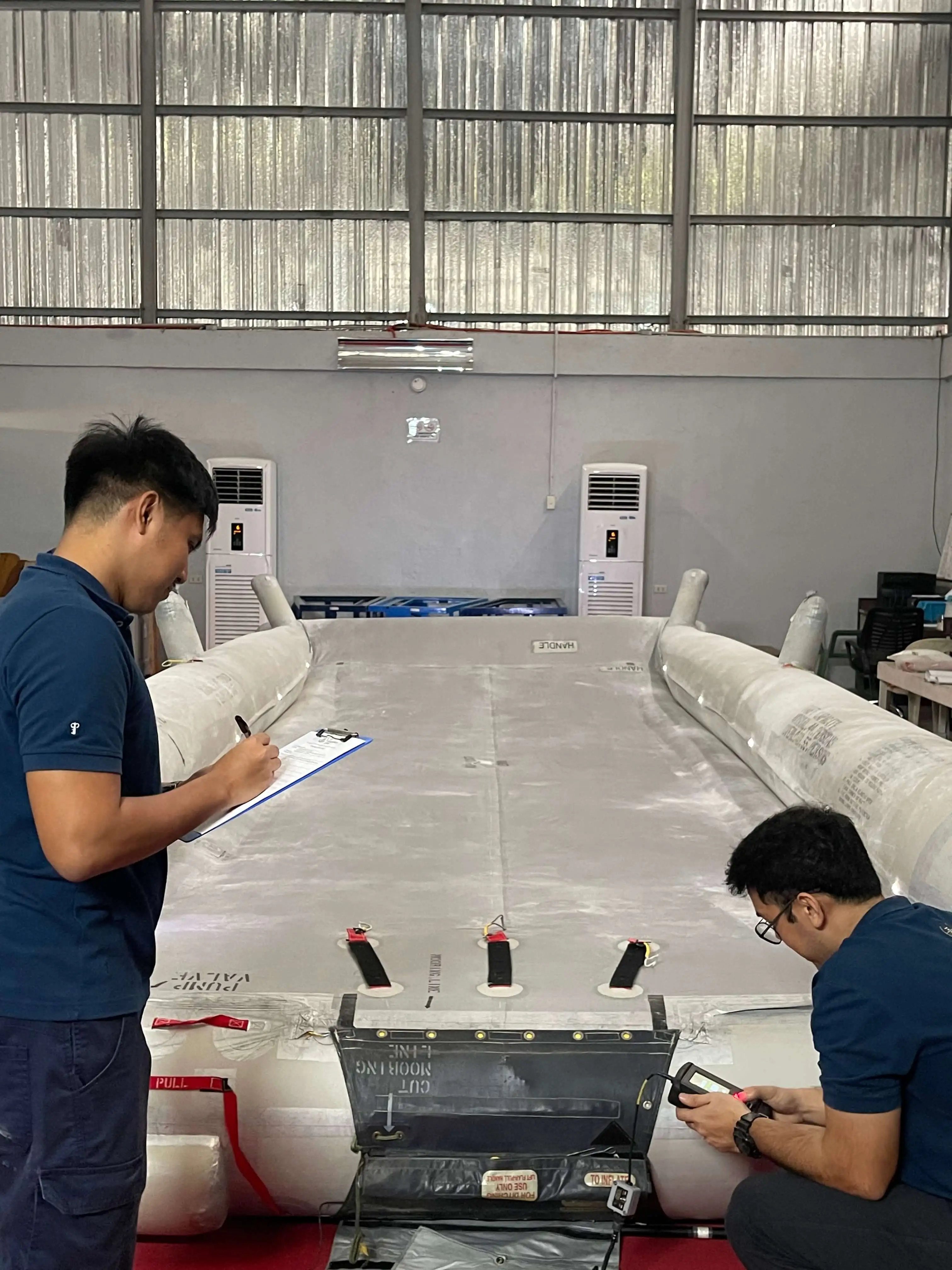 RD Aerospace technician inspecting and maintaining an aircraft emergency evacuation slide