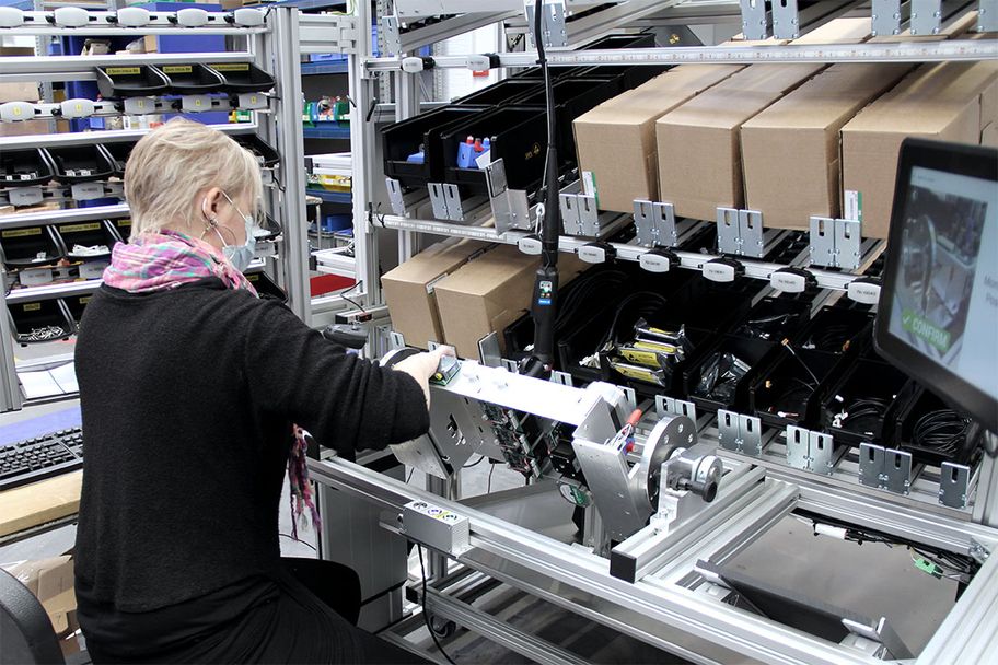 Employee assembles at a LEAN workstation