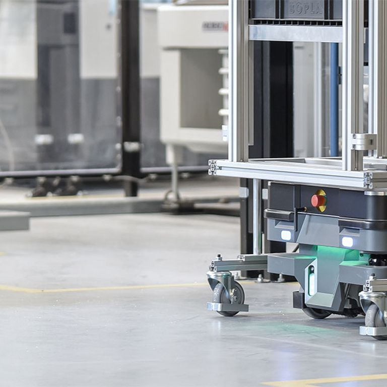 Autonomous mobile robots transport material