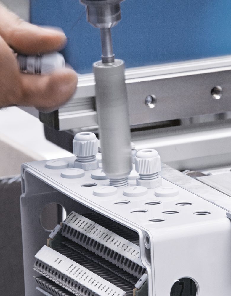 Mounting cable glands on an enclosure