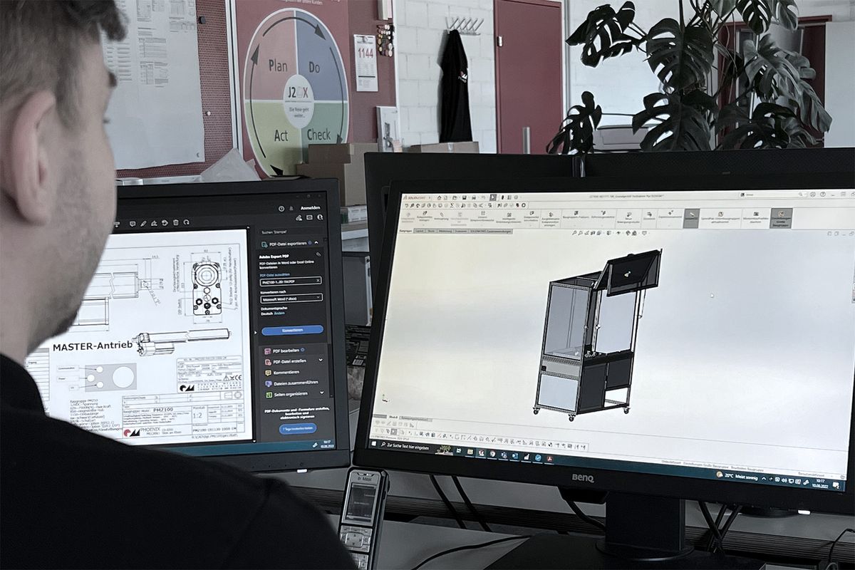 An engineer designs a machine housing on the CAD system