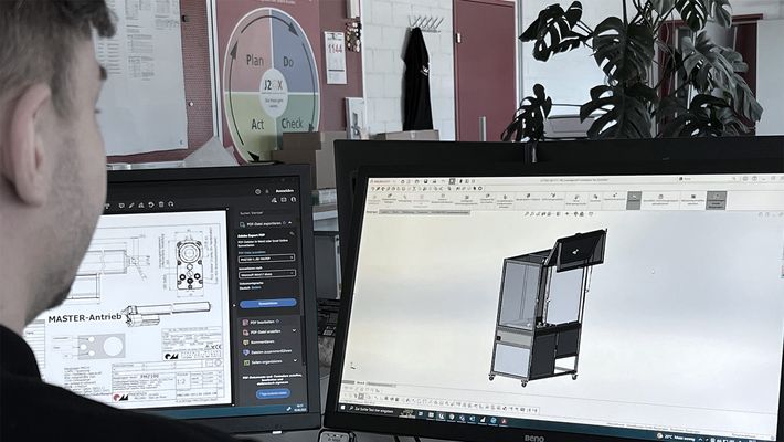 An engineer designs a machine housing on the CAD system