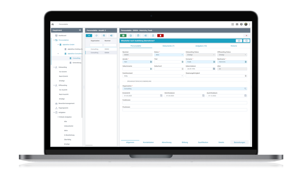 Laptop displaying a complex software interface with tabs, forms, and navigation pane, featuring user personal data input fields.